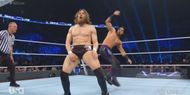 Mustafa Ali prepares to superkick an unwary Daniel Bryan.